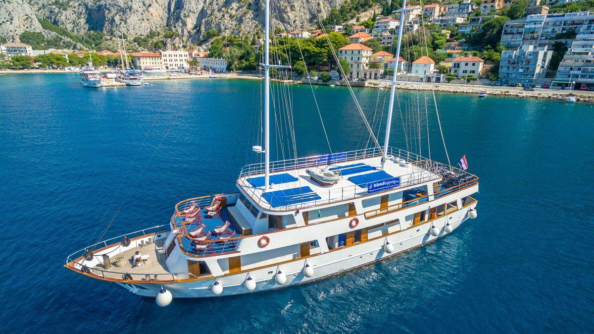 Island hopping Croatia bike and boat experience showing cyclists boarding a small cruise ship