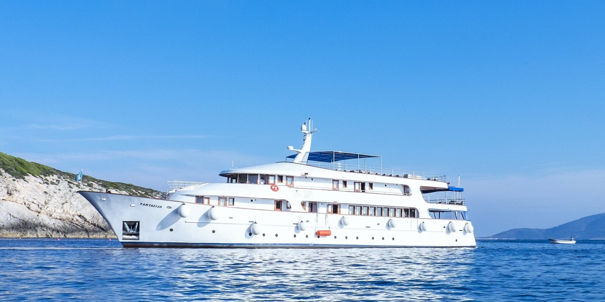 Luxury Croatia cruise ship with balcony cabins sailing along the Adriatic coastline