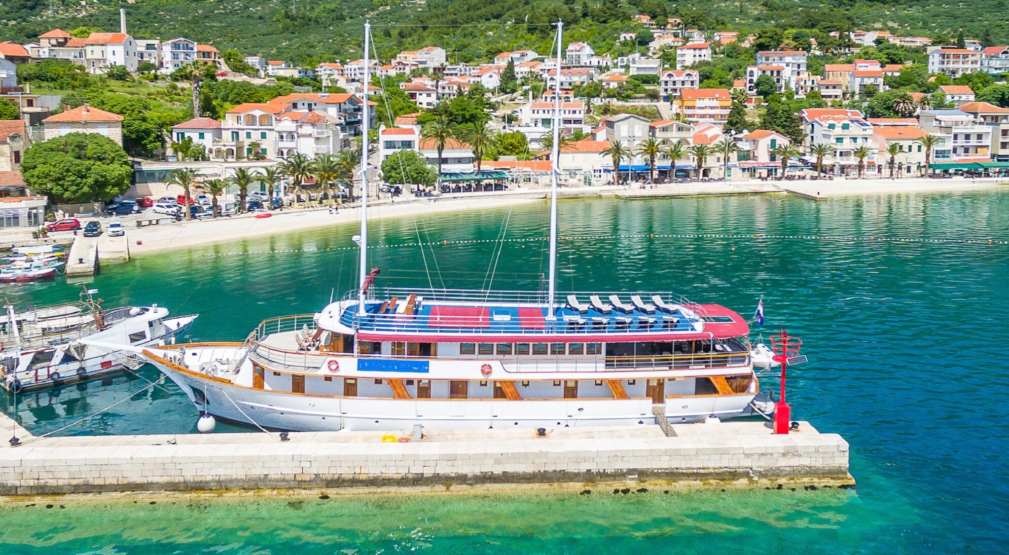 Cyclists enjoying an e-bike cruise Croatia adventure along a stunning coastal road