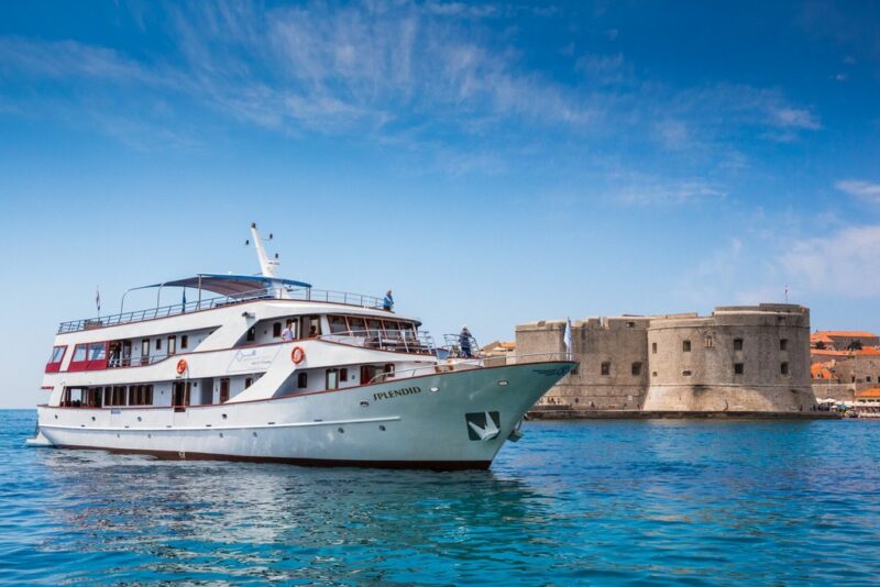 Passengers enjoying a swimming stop during an affordable Croatian journey in a secluded bay