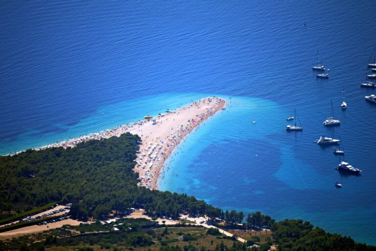 Beachgoers on Zlatni Rat beach at Bol on Brac Island