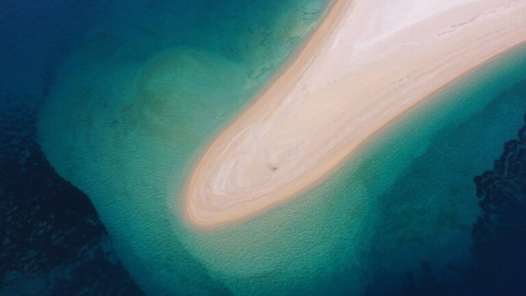 Zlatni Rat beach beside clear Adriatic water in Bol