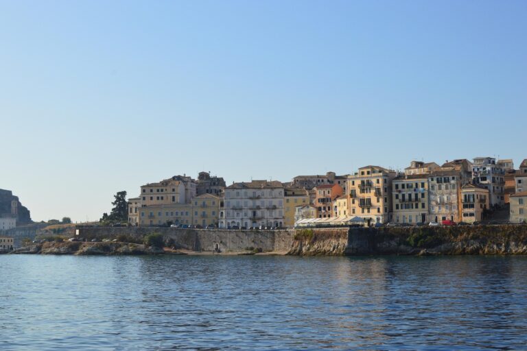 Stone waterfront buildings of a coastal town on Corfu, Greece